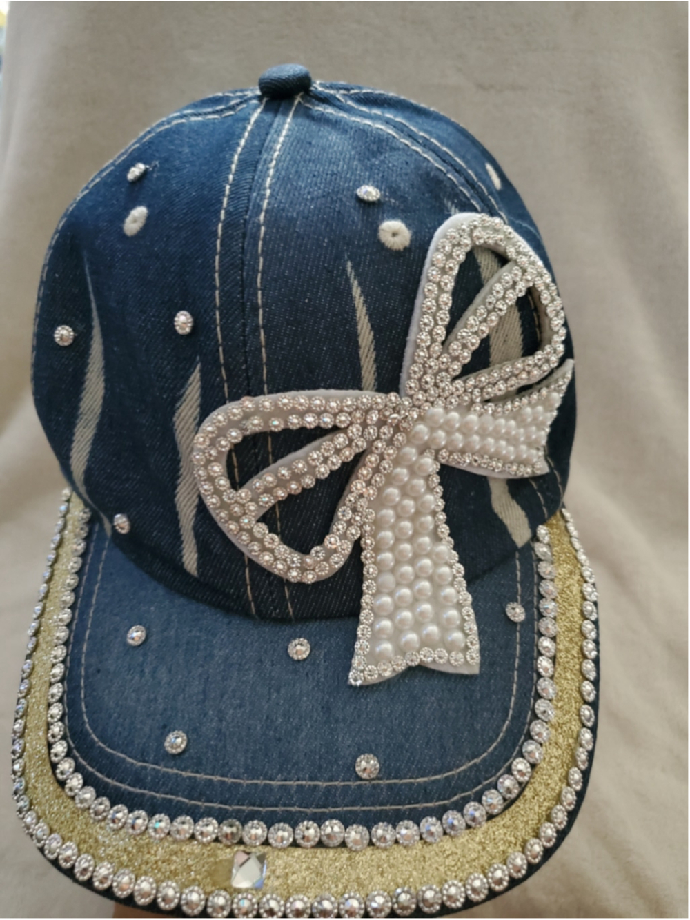 Go 2 the game n style with this adjustable Blue & Gold Deim iRhinestone Bow